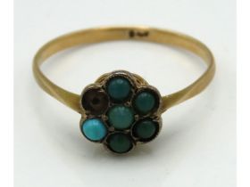 An antique 9ct gold 'daisy' ring set with turquois