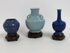 Three 20thC. Chinese vases with hardwood stands, t