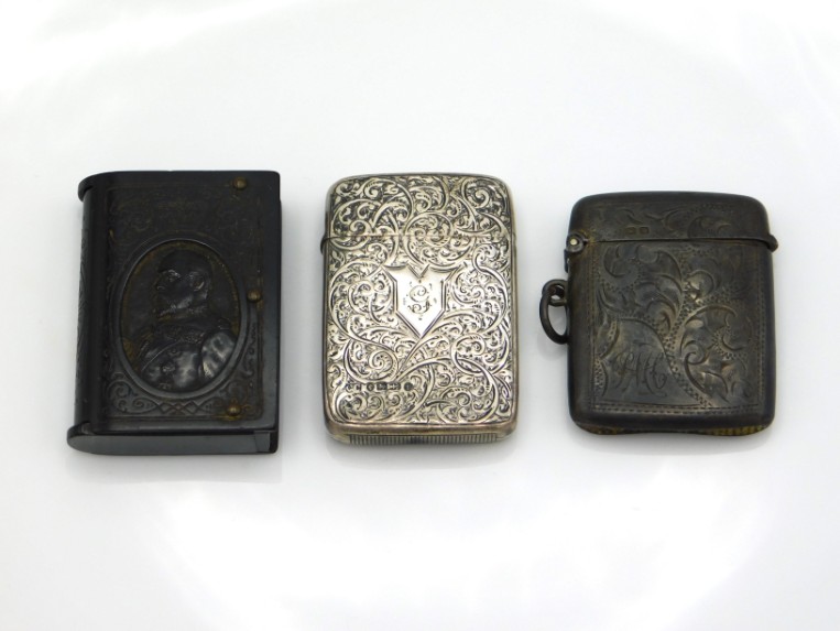 Two Birmingham silver vesta cases, 1919 by TM & Co. & 1883 by Colen Hewer Cheshire twinned with an E