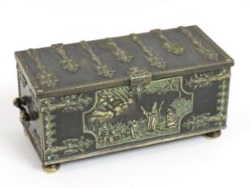 A cast bronze style box with embossed mottos in Da