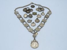 A silver Ceylon coin necklace, 21 twinned with oth