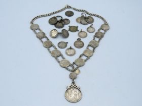 A silver Ceylon coin necklace, 21 twinned with oth