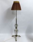 A decorative brass lamp with silk shade, 1700mm ta
