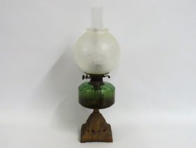 A Duplex oil lamp with green well & etched shade,