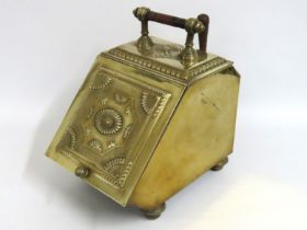 A brass coal scuttle & scoop with embossed decorat