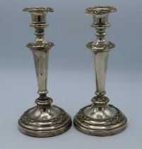 A pair of continental silver candlesticks, one det