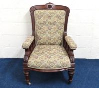An antique upholstered armchair, 1041mm high to ba