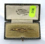 A 9ct gold bar brooch, 46mm wide, 1.3g