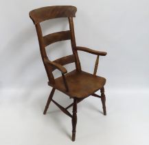 A 19thC. elm Windsor style chair