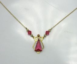 A 9ct gold necklace & pendant set with pearl & top