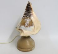 A carved conch shell converted into a lamp, 295mm