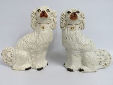 A pair of Staffordshire pottery mantle dogs, 330mm