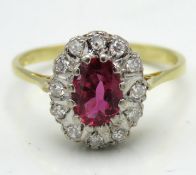 An 18ct gold ruby & diamond ring, ring head 12mm x