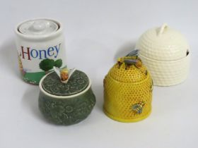 A Japanese Marutomoware pottery honey pot with bee