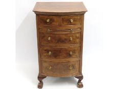 A walnut five drawer chest of drawers with ball &