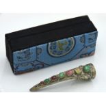 An Oriental silver finger brooch set with jade & o
