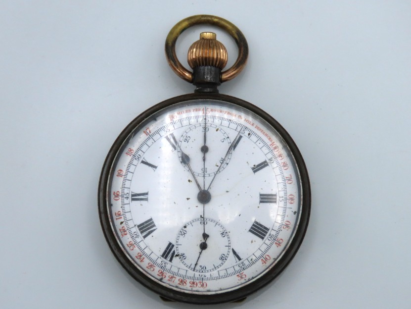 A steel chronograph pocket watch with outer early tachymeter track for racing and written 'Miles Per