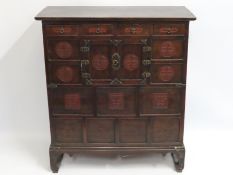 An Oriental cabinet with cupboard & four drawers,