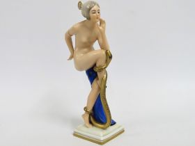 An art deco porcelain figure of nude dancer with s