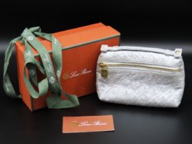 A designer ostrich skin mini pouch by Loro Piana w