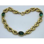 An 18ct gold bracelet set with possibly tsavorite,
