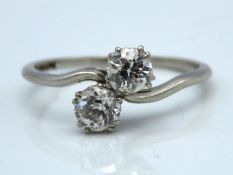 A 1920's platinum crossover ring set with approx.