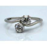 A 1920's platinum crossover ring set with approx.