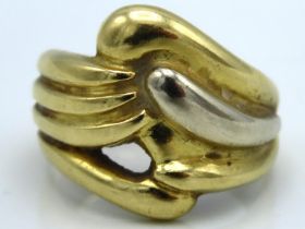 An 18ct gold ring of organic form, some dents to r