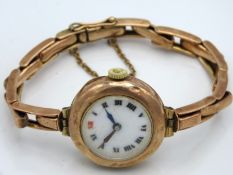 A ladies 9ct rose gold case & strap wristwatch wit