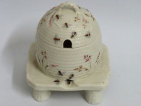 A Belleek porcelain beehive honey pot, black mark
