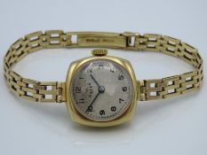 An Aster ladies wristwatch with 9ct gold case & st