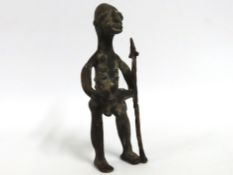 An African Benin bronze figure of warrior with tri