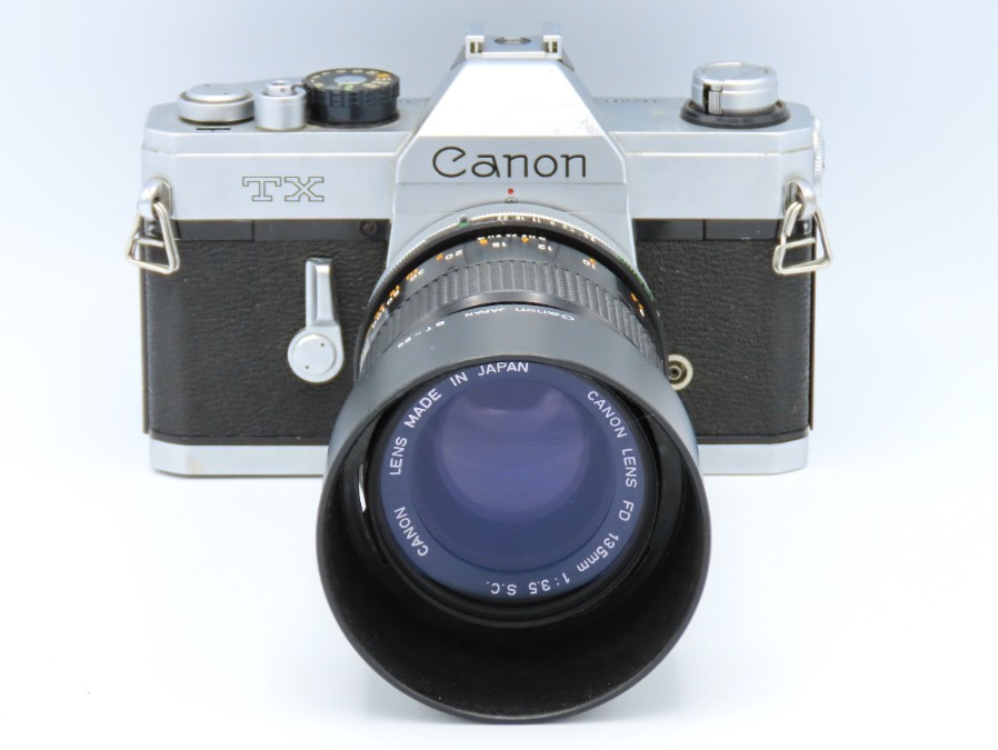A Canon TX 35mm film camera with Canon FD 135mm le