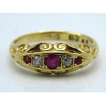 An antique 18ct gold ring with carved decor set wi