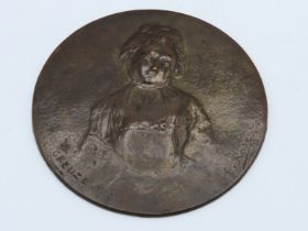 A bronze WMF plaque inscribed Creuze pixit, signed