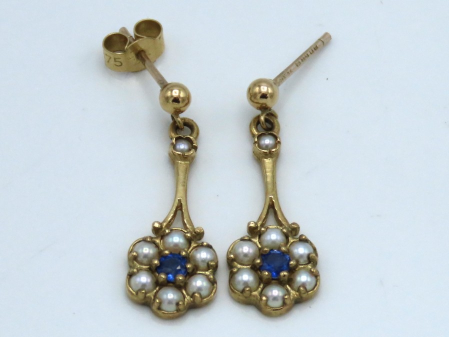 A pair of 9ct gold drop earrings set with pearl &