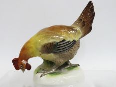 A 19thC. continental porcelain model of a rooster,