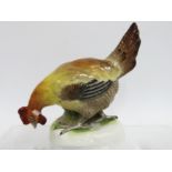 A 19thC. continental porcelain model of a rooster,