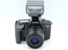 A Canon EOS 650 35mm film camera & manual with Can