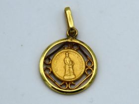 A 14ct gold pendant, text indistinct, 22mm drop, 1