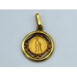 A 14ct gold pendant, text indistinct, 22mm drop, 1