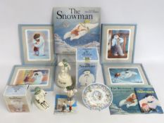 A selection of Raymond Briggs The Snowman related items including Royal Doulton figures, Snowman LP,