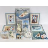 A selection of Raymond Briggs The Snowman related items including Royal Doulton figures, Snowman LP,