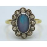 An 18ct gold ring with platinum set opal doublet &