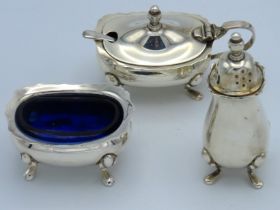 A matched three piece condiment set including make