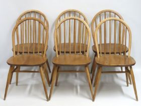 A set of six 1960's Ercol elm dining chairs, 810mm