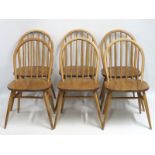 A set of six 1960's Ercol elm dining chairs, 810mm