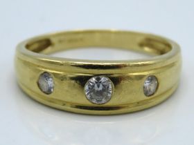A 14ct gold ring set with three diamonds of approx. 0.4ct, 4.6g, size X