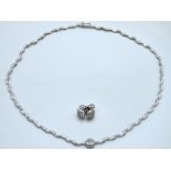 An 18ct white gold & diamond necklace & earring se