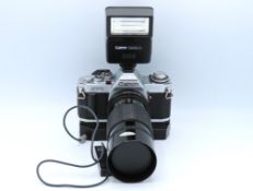 A Canon AV-1 35mm film camera with Canon Zoom 70-1